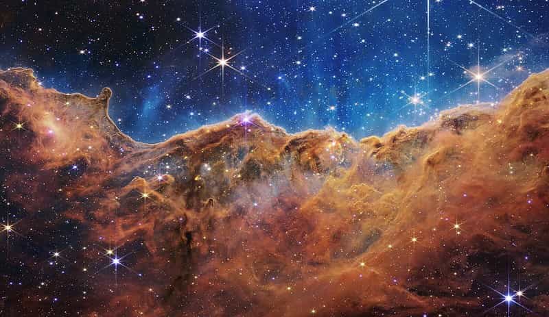 NASA’s Webb Reveals Cosmic Cliffs, Glittering Landscape of Star Birth (NASA, ESA, CSA, and STScI)